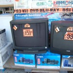 Televisions, air conditioners and stereo systems for sale on outside
