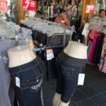 Women's jeans, dresses on display outside